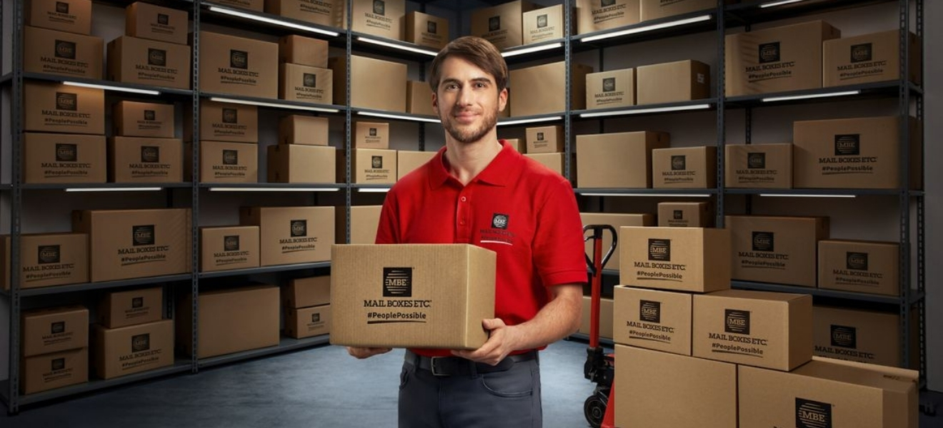 MBE courier with Mail Boxes Etc. parcel